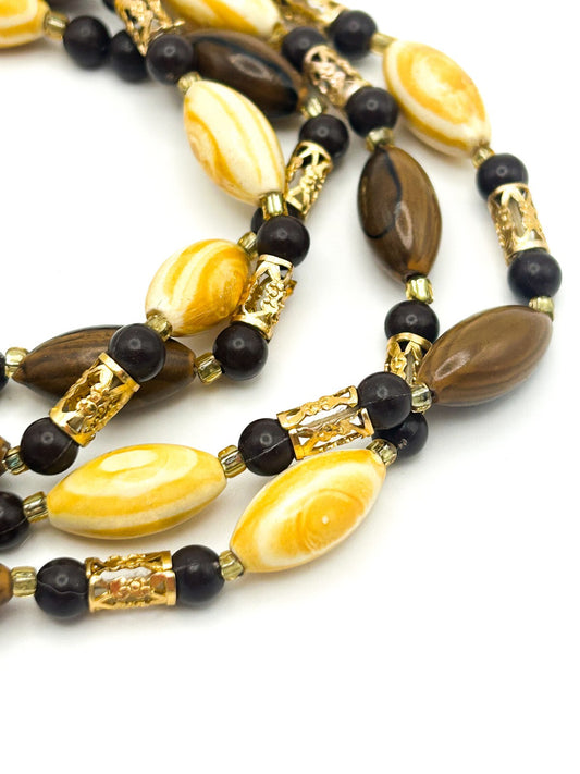 Vintage 70s Brown & Yellow Swirl and Gold Tone Openwork Tube Bead Long Necklace