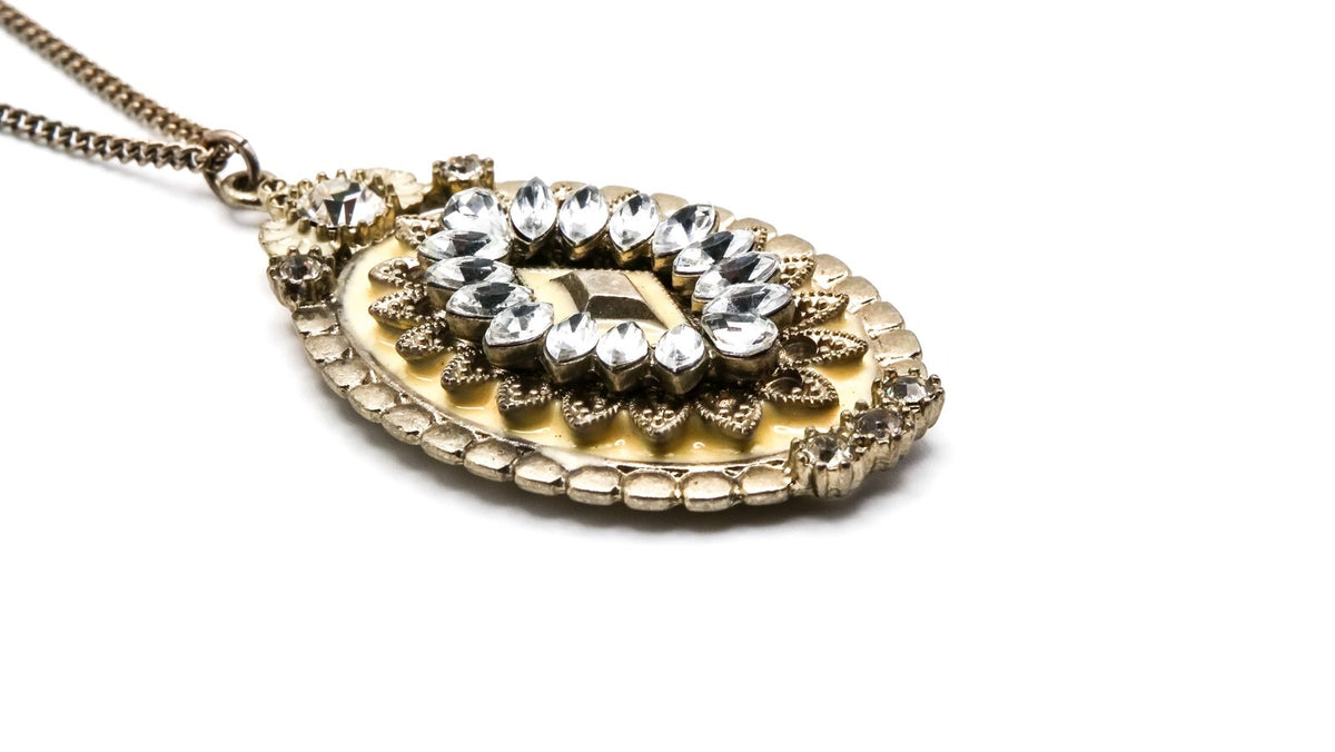 Oval Cream & Rhinestone Ornate Pendant | 33" Length, Gold Tone