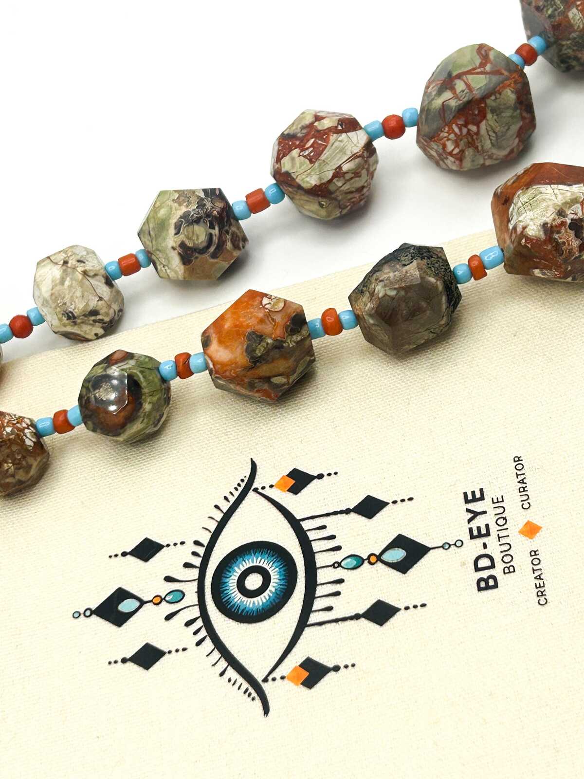 Graduated Raw & Faceted Jasper Statement Necklace with Blue and Red Glass Spacer