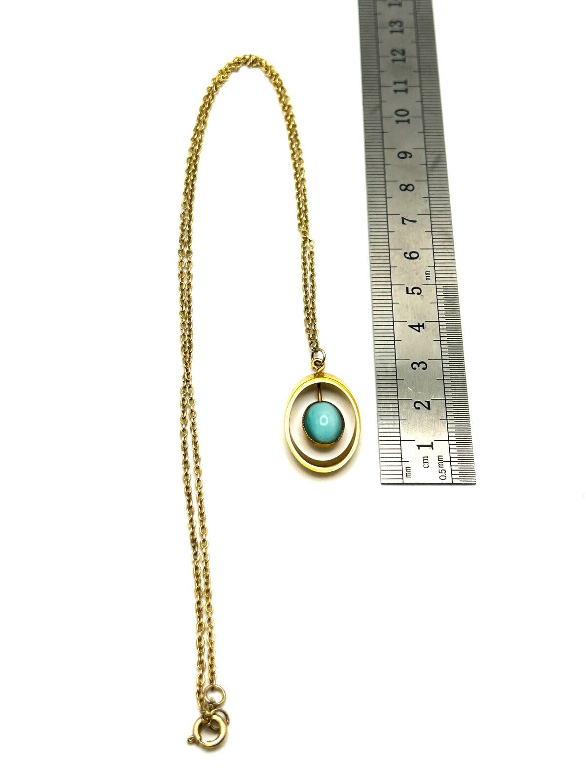 Gold Tone Openwork Oval Pendant Necklace with Turquoise Cats Eye Cabochon