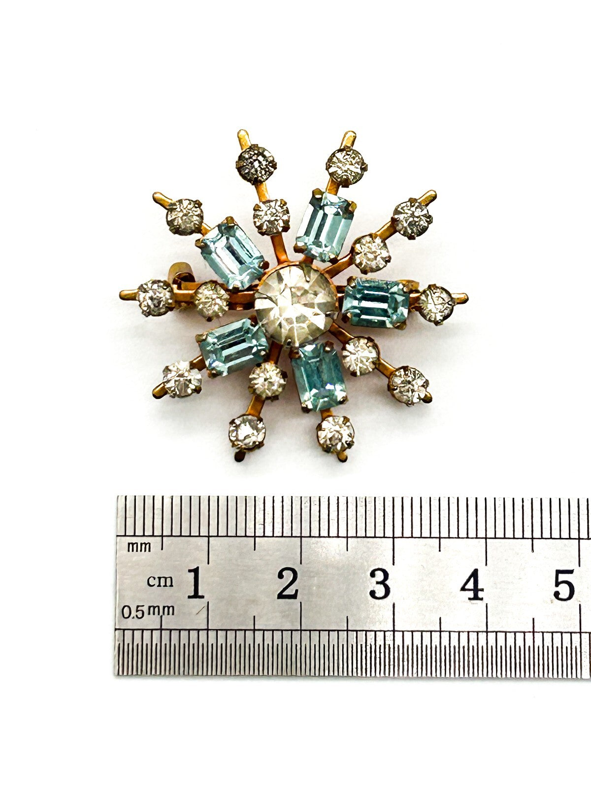 Vintage Blue Clear Rhinestone Starburst Brooch Gold Tone Atomic Snowflake Pin