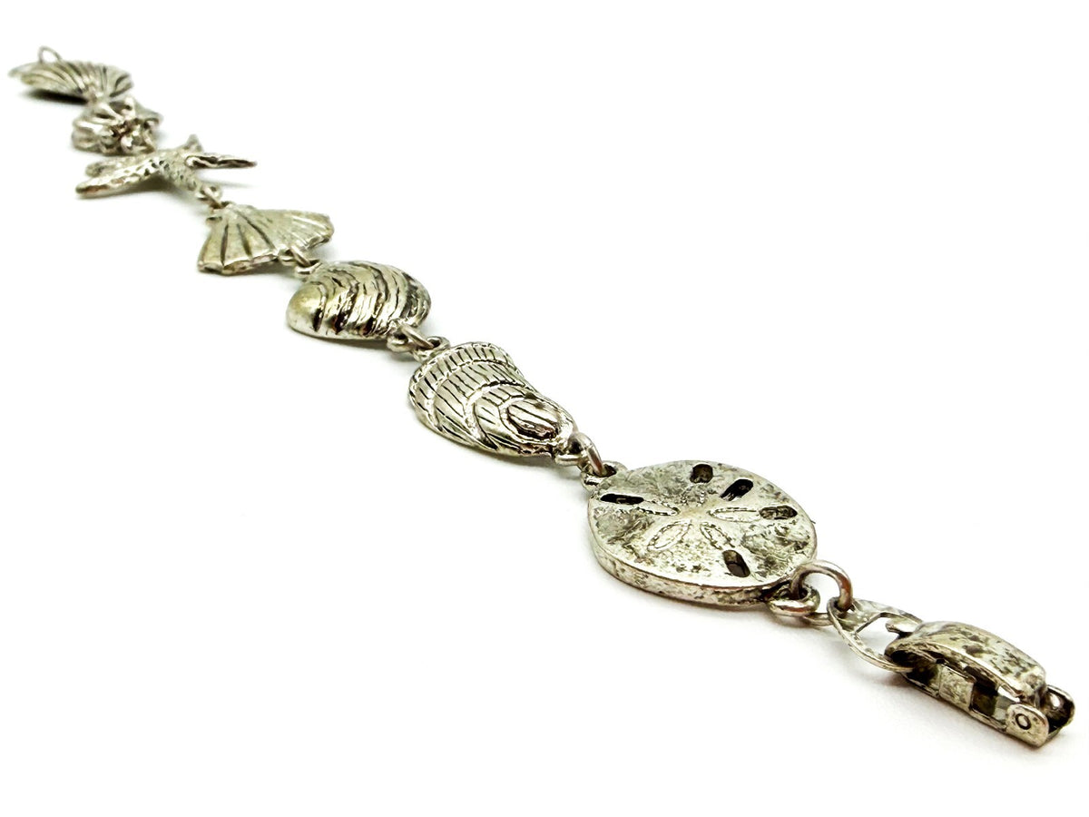 Signed SJ Silver Tone Beach Charm Bracelet Shell Starfish Nautical 7.5”