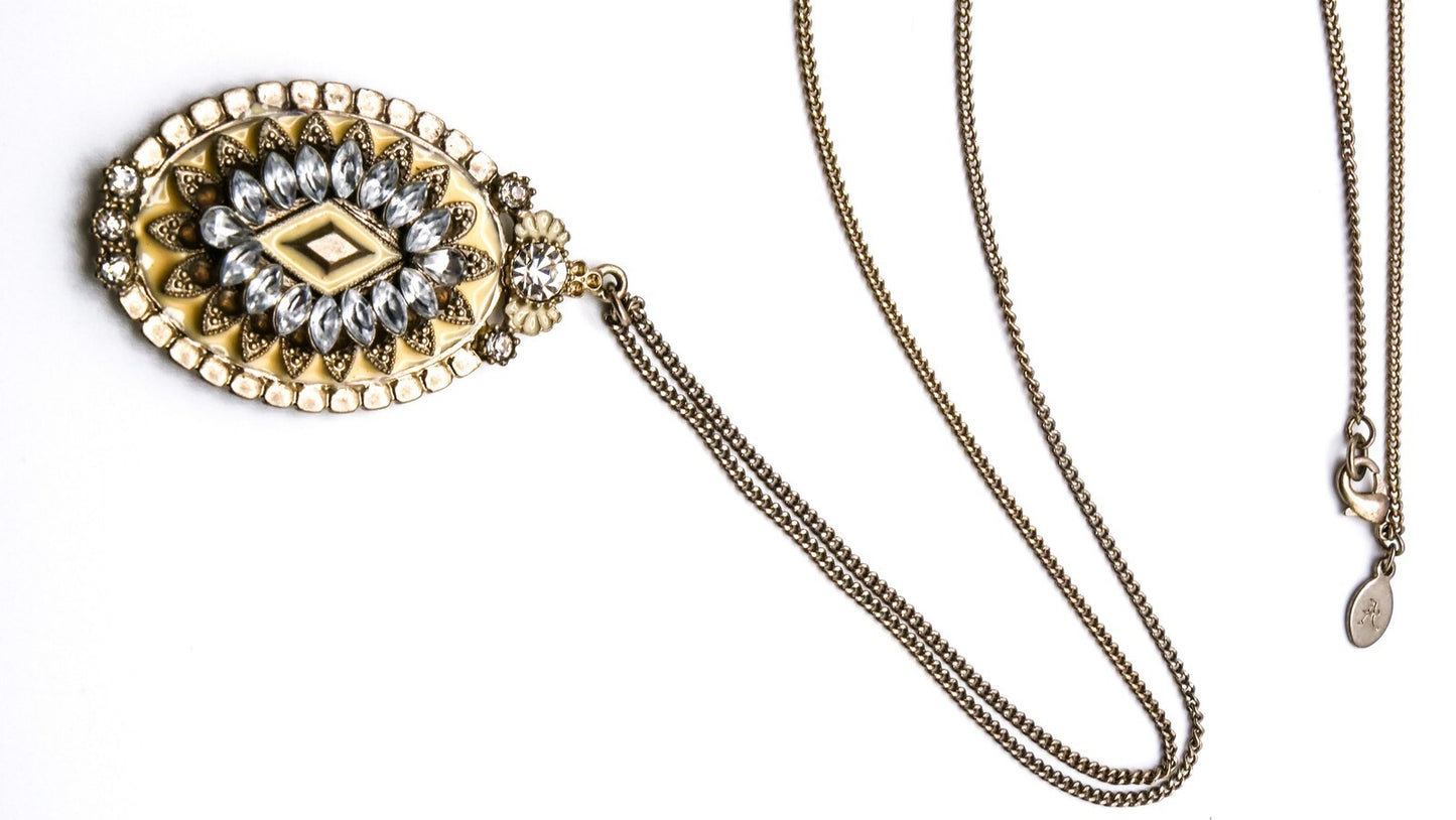 Oval Cream & Rhinestone Ornate Pendant | 33" Length, Gold Tone
